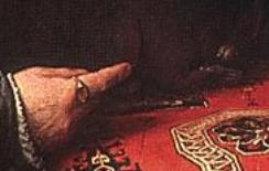 Кольцо с рубином на пальце мужа, указывающем на белку