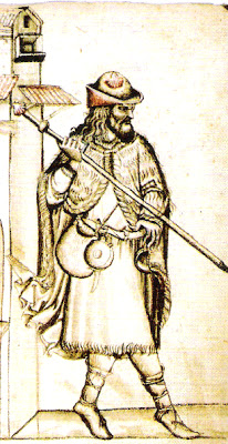 Религиозный паломник с сумой на поясе и посохом